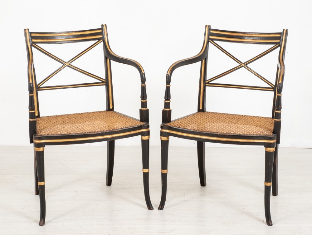Pair Of Regency Style Ebony and Gilt Open Arm Chairs
