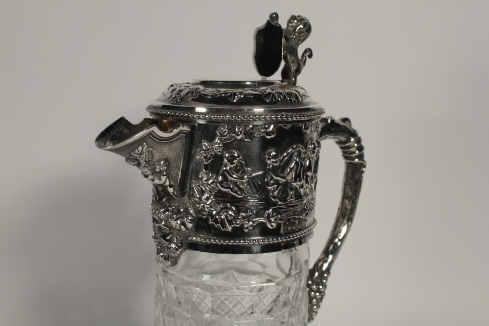 A Pair of Cut Glass and Silver Plate Portuguese Claret Jugs View II