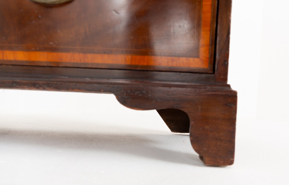 A tall Sheraton Revival mahogany two-door wardrobe featuring inlaid panelled doors, a lower base drawer, and bracket feet. View VIII