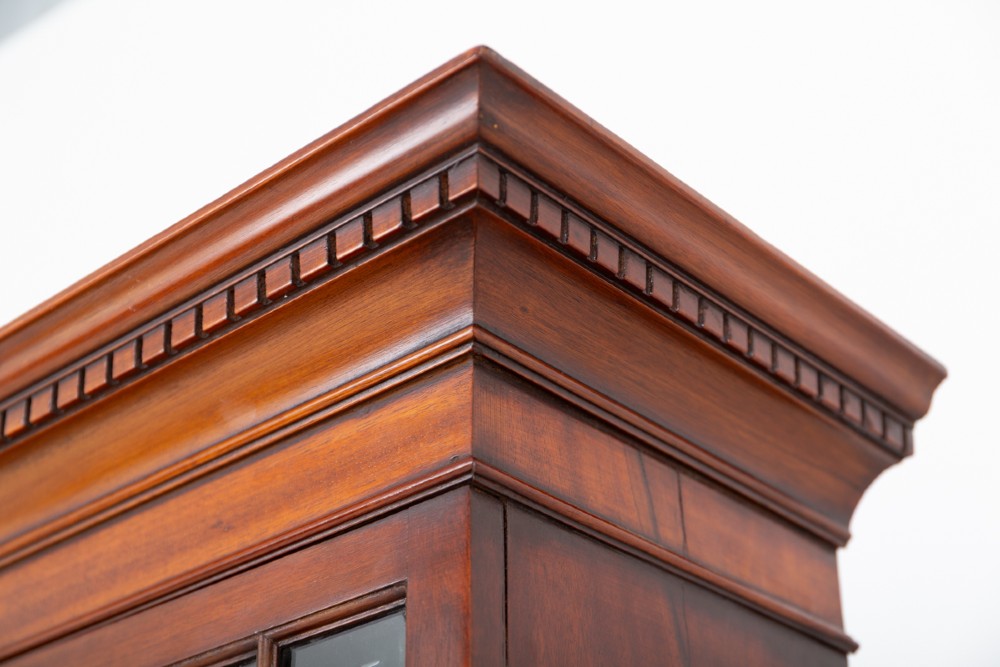 A Georgian mahogany bureau bookcase featuring an upper cabinet with astragal glazed doors, a slant-front writing slope, four graduated drawers, and bracket feet. View II