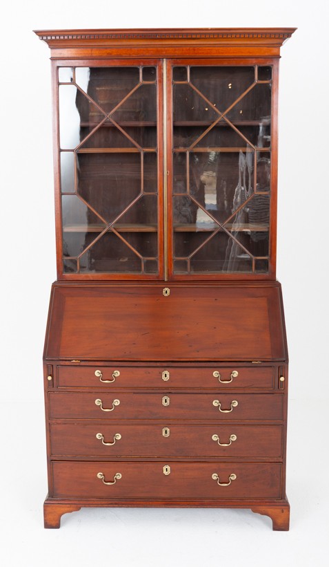 A Georgian mahogany bureau bookcase featuring an upper cabinet with astragal glazed doors, a slant-front writing slope, four graduated drawers, and bracket feet. View VII