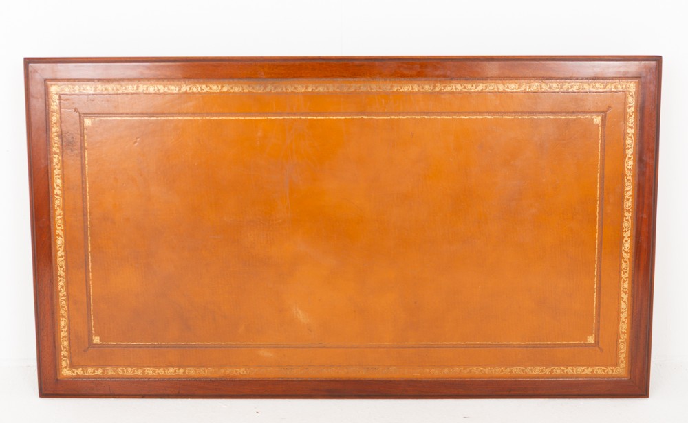A Georgian style mahogany partners desk featuring a tan leather writing surface, multiple drawers with oval brass handles, and twin pedestal supports. View VII