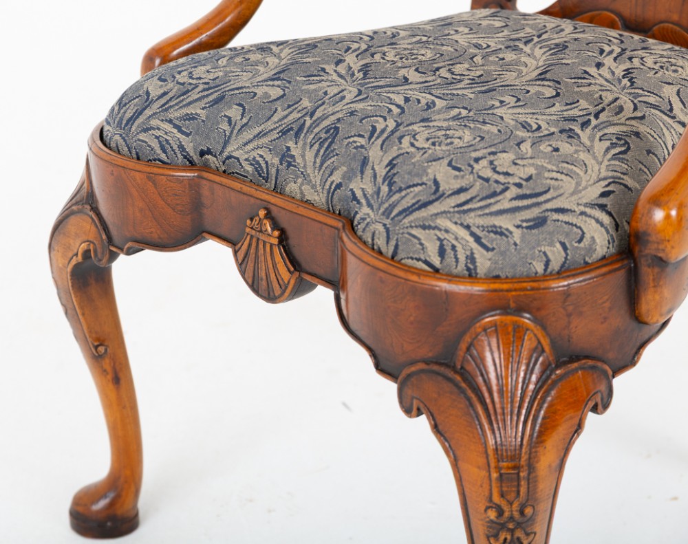 A large set of twenty Queen Anne style elm dining chairs featuring shaped vasiform back splats, upholstered patterned seats, and cabriole legs with carved shell details. View V