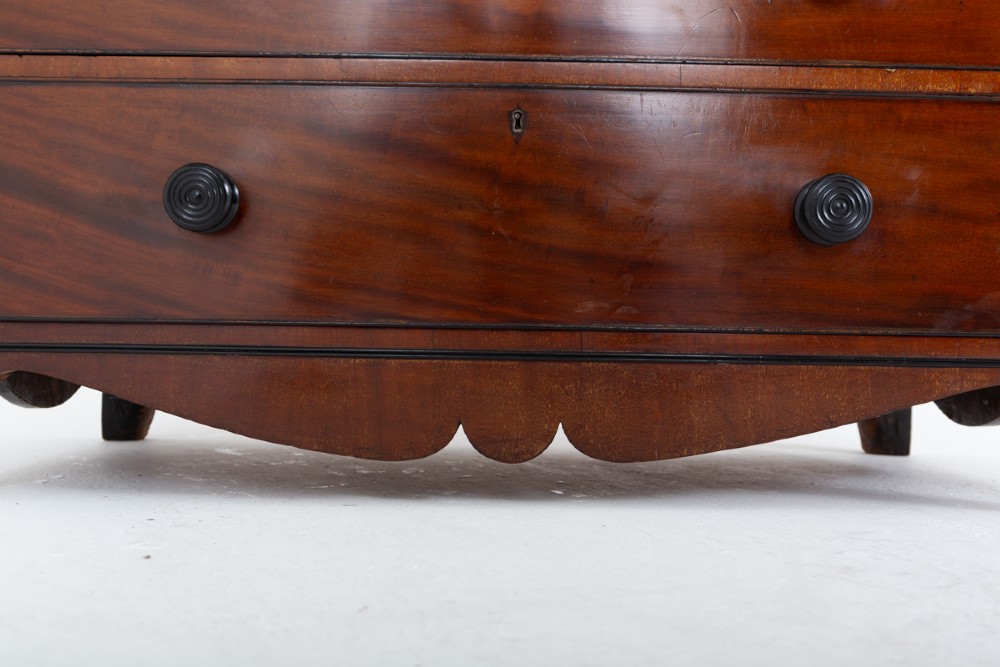 A Regency mahogany cylinder bureau bookcase featuring Gothic astragal glazed upper doors above a curved roll-top desk and three long drawers with turned dark handles. View IX
