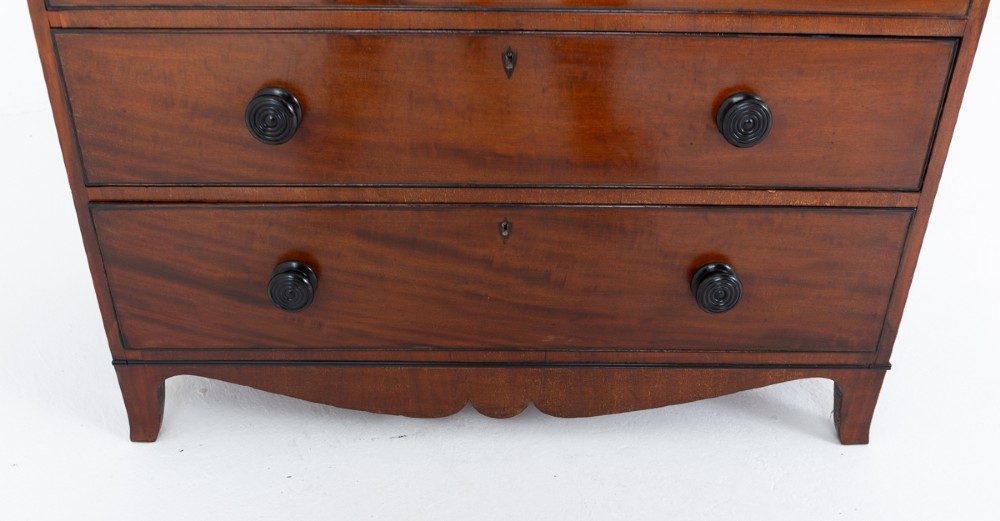 A Regency mahogany cylinder bureau bookcase featuring Gothic astragal glazed upper doors above a curved roll-top desk and three long drawers with turned dark handles. View X