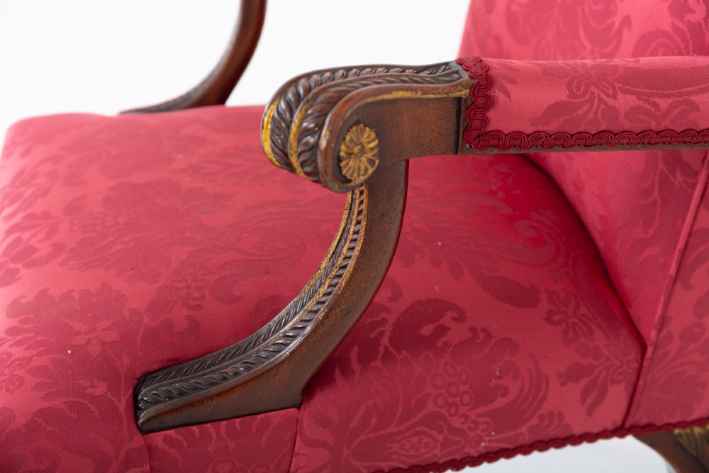 A Chippendale style armchair upholstered in red damask fabric with carved mahogany cabriole legs and parcel-gilt detailing. View IV