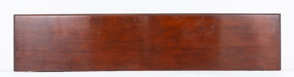 A wide Victorian open mahogany bookcase featuring a panelled back, two horizontal shelves, and turned feet. View XI