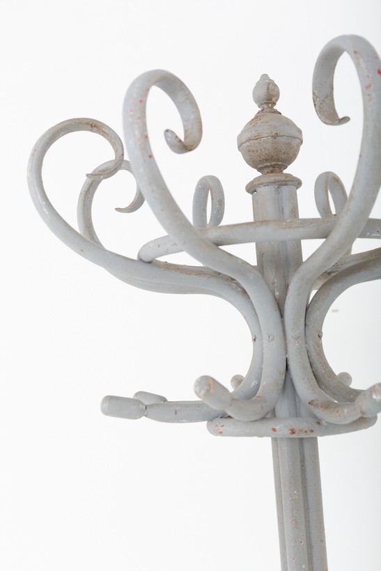 A tall grey painted bentwood hallstand featuring upper scrolled hooks, a central turned finial, and an integrated lower umbrella ring base. View VI