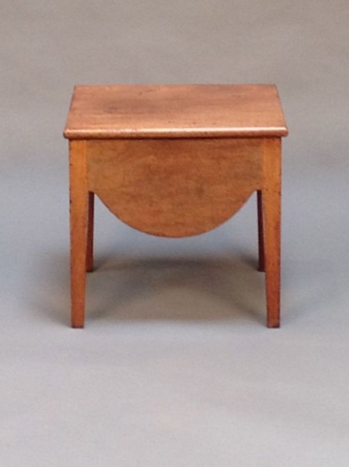 A 19thc. Mahogany Box Stool on Square
tapered Legs.
