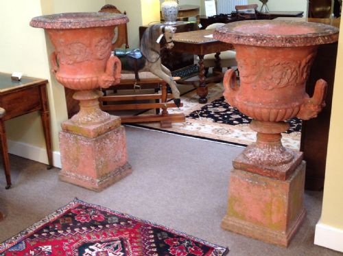 A Pair of Terracotta Urns on Stands C. Early 20thc.
