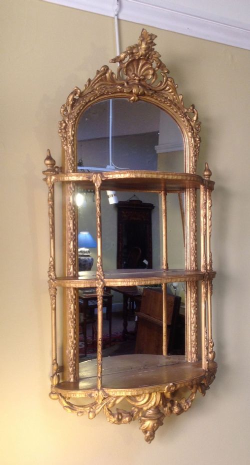 A Three Tiered Gilded Mirror