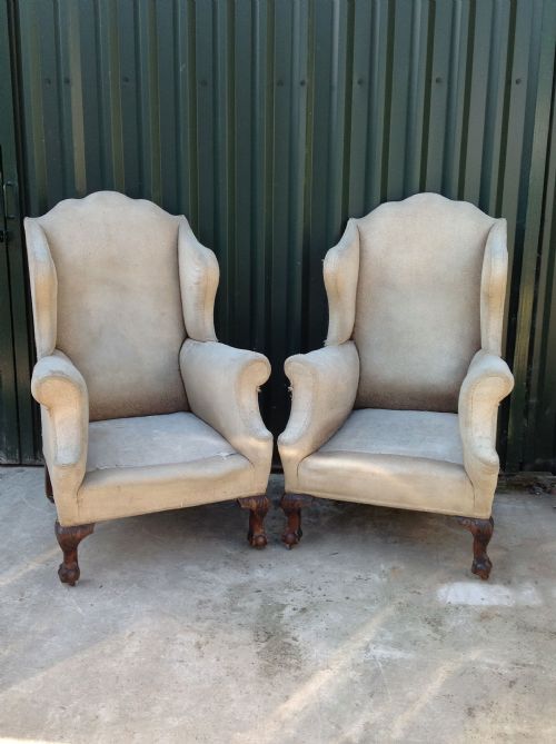 A Pair of 19thc. Walnut Claw & Bow Wing Armchairs