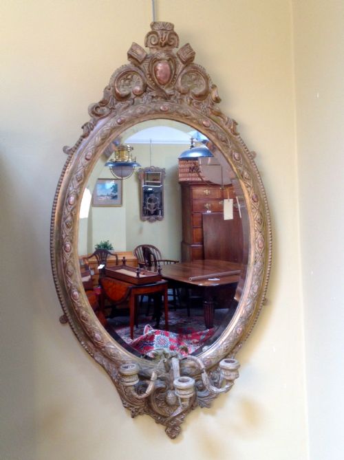 19thc. Gilt Oval Mirror with Distressed Finish & Candelabra.