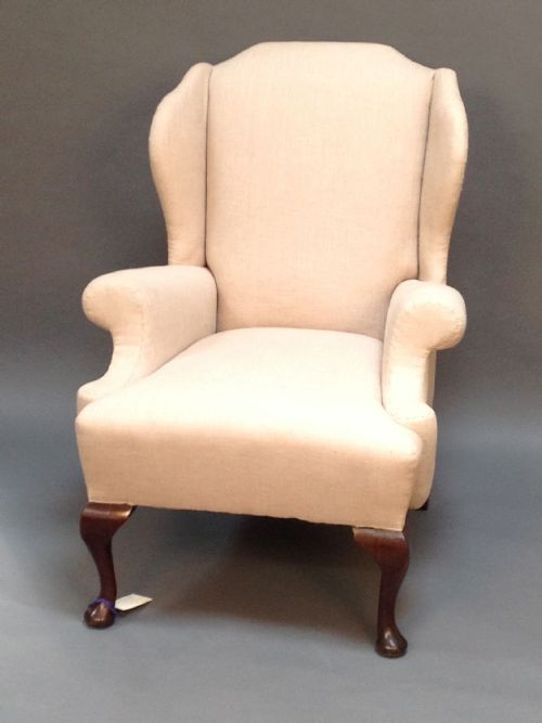 An Early 20thc. Walnut Wing Armchair with Scroll Arms