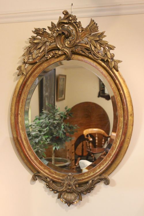 A Very Fine Gilded Oval Mirror