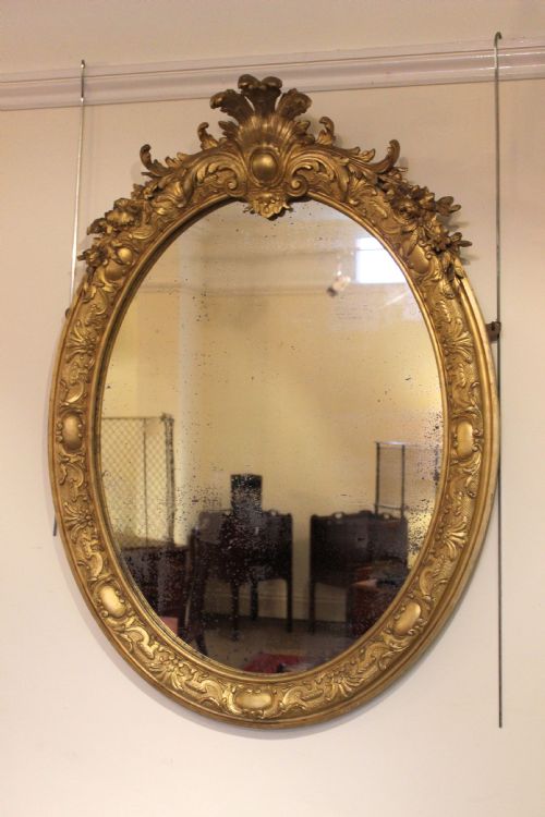 A Fine 19thc. Oval Gilded Mirror