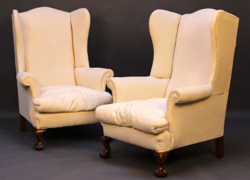 A Pair of Late 19thc. Claw & Ball
winged Armchairs