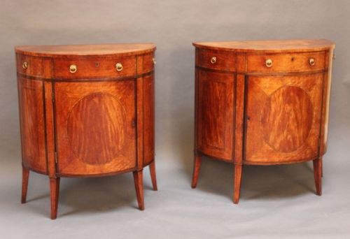 A Magnificent Near Pair of Satinwood Bow Fronted Commodes