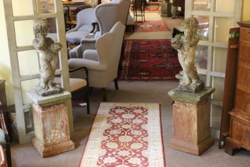 Pair Early 20thc of Reconstituted Cherubs on Cast Iron
bases