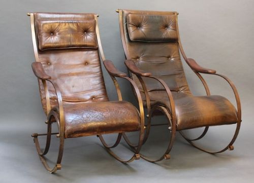 A Pair of 19thc Metal and Leather Rocking Chairs