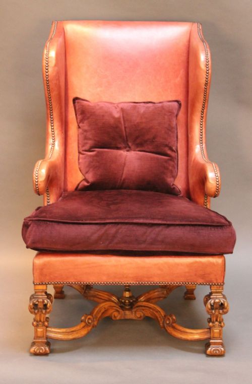 A 19thc. Oak Carved Wing Armchair Upholstered in Red Leather