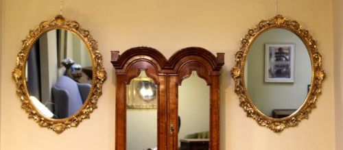 A Pair of Late 19thc. Gilt Wood Oval Mirrors