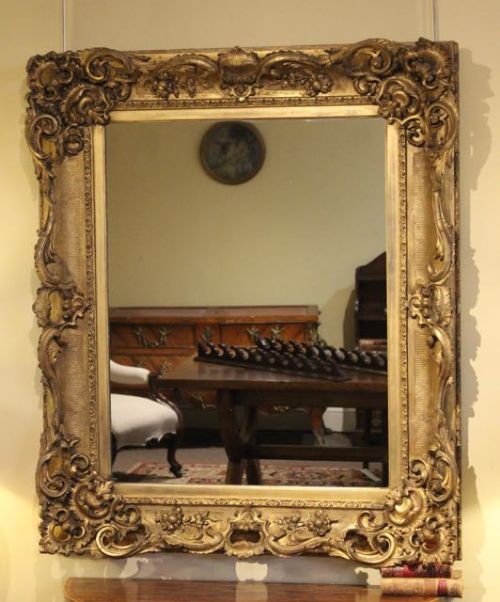 A Fine 19thc. Gilded Frame
with Later Mirror Plate
