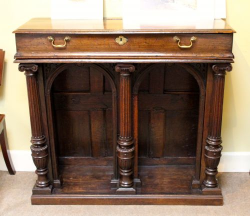 AN UNUSUAL 18THC OAK SIDE TABLE