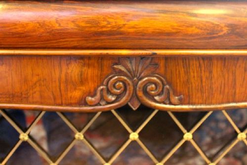 A 19th-century dark rosewood chiffonier cabinet featuring a raised top shelf on turned columns and two doors with brass wire lattice grilles. View V