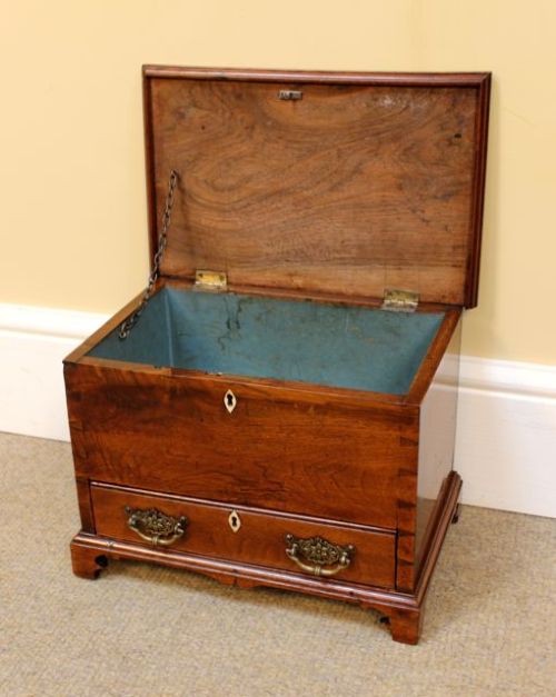 A 19th-century miniature walnut mule chest featuring visible dovetail joinery, a hinged top lid, a single lower drawer with decorative brass handles, and bone keyhole escutcheons. View IV