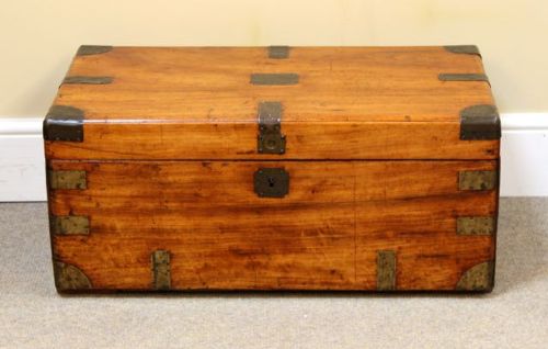 A nineteenth-century rectangular camphor wood chest featuring brass corner brackets, protective brass strapping, and a central keyhole escutcheon. View II
