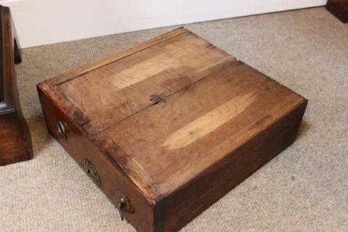 An 18th-century Georgian walnut chest of drawers featuring two short over two long drawers with brass drop handles and bracket feet. View VIII