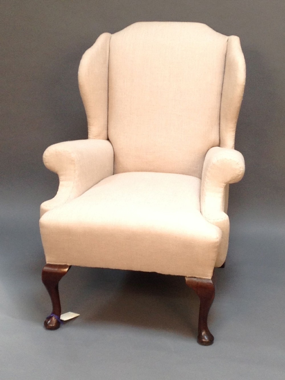 An Early 20thc. Walnut Wing Armchair with Scroll Arms