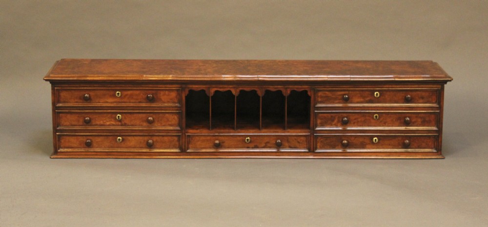 A 19thc Burr Walnut 7 Drawer Table Top Cabinet