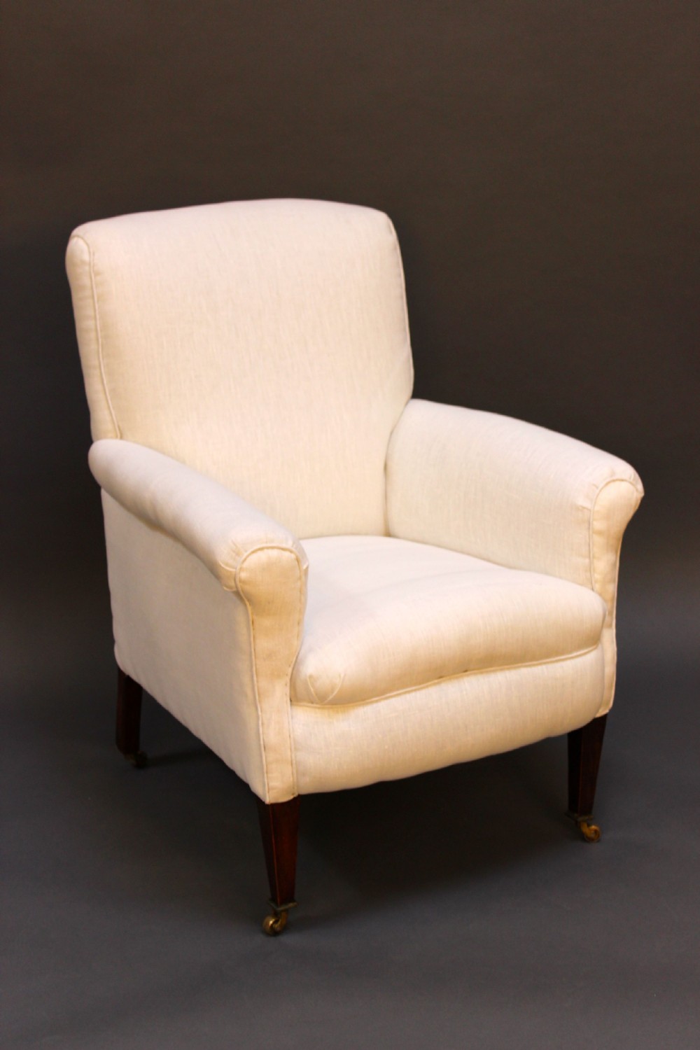 A late 19thc. Armchair on square tapered mahogany legs