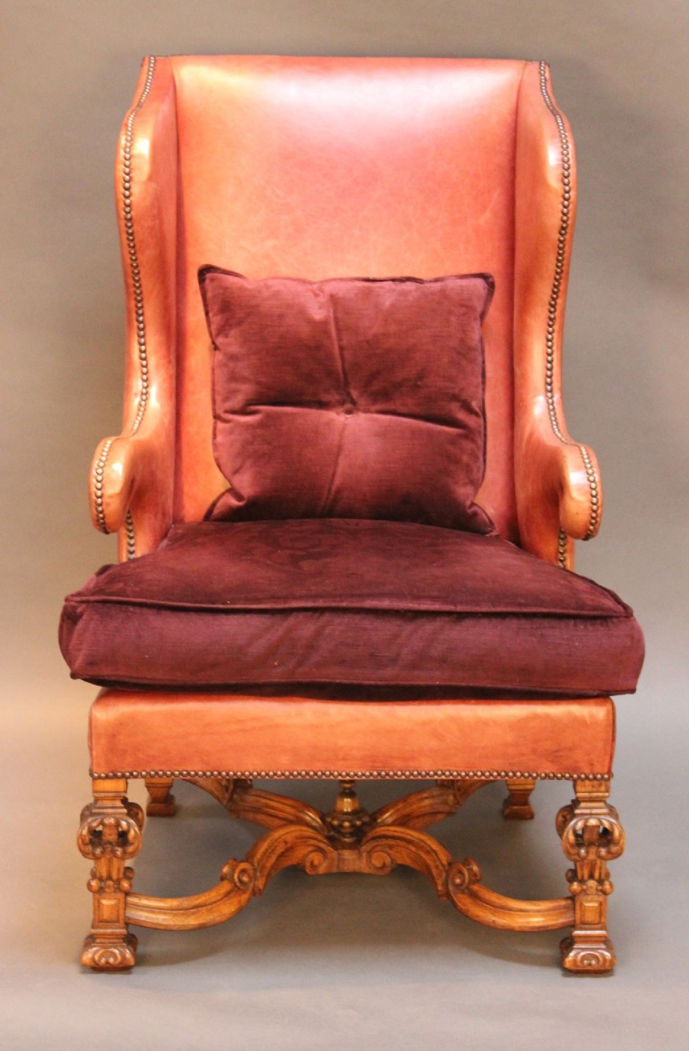 A 19thc. Oak Carved Wing Armchair Upholstered in Red Leather