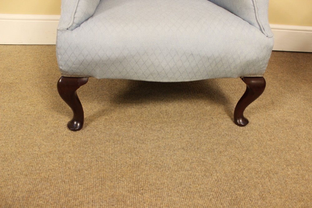 A small 19th-century upholstered armchair featuring light blue patterned fabric and dark mahogany cabriole legs. View III