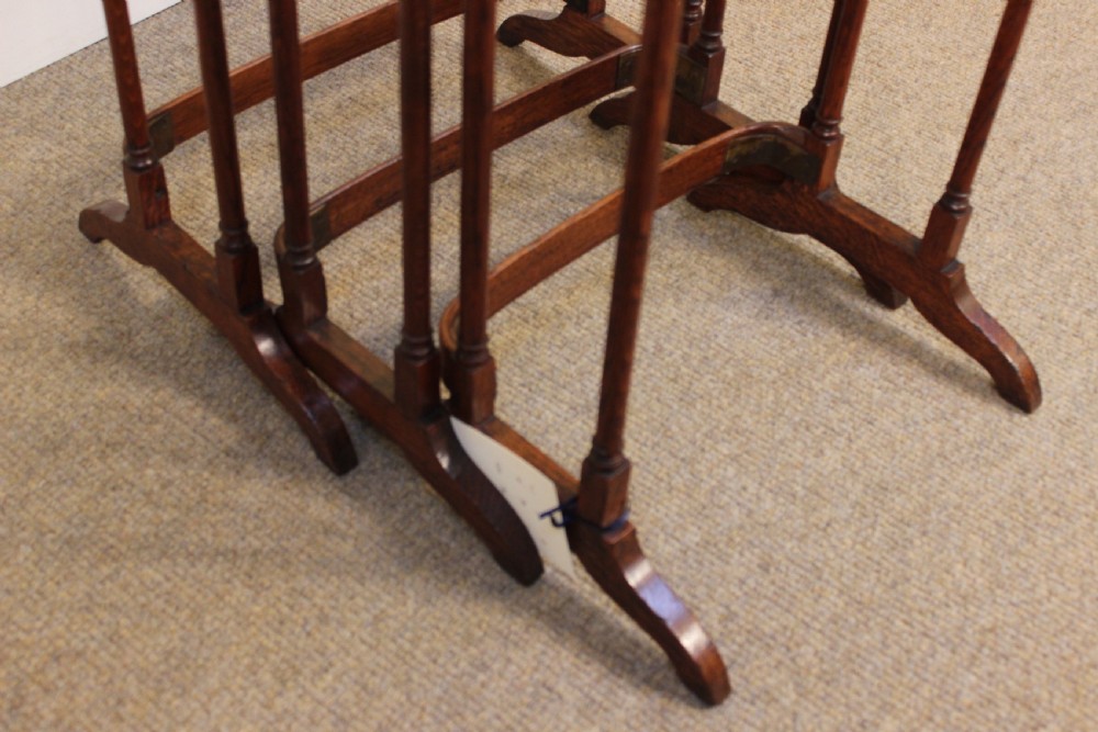 A set of three 19th-century oak nesting tables featuring rectangular tops, slender turned legs, and curved stretcher bases. View IV