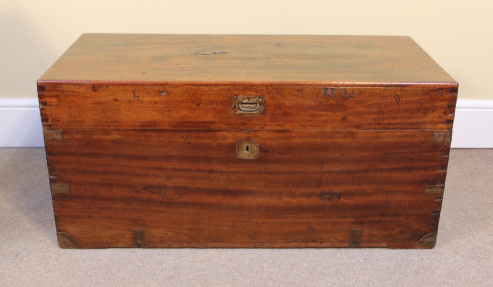 A nineteenth-century camphor wood campaign chest with visible dovetail corner joints and flush brass hardware.