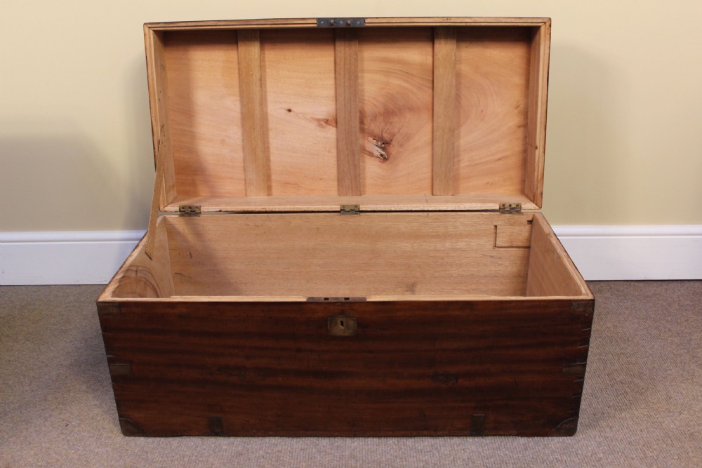 A nineteenth-century camphor wood campaign chest with visible dovetail corner joints and flush brass hardware. View V