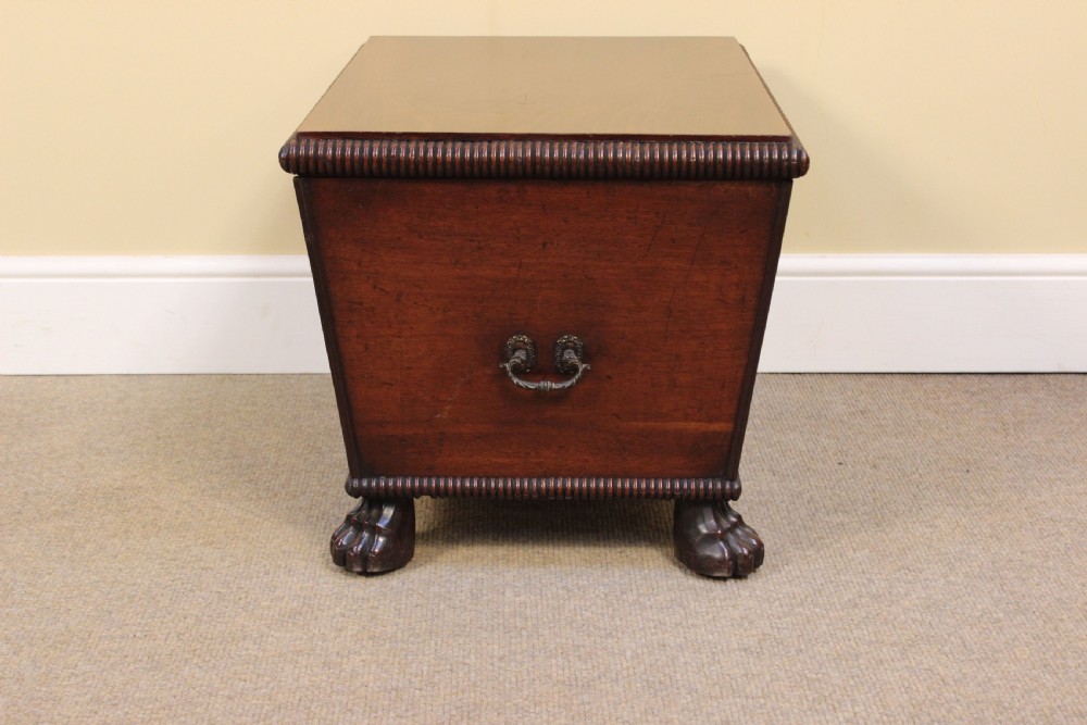 A nineteenth-century mahogany sarcophagus-shaped cellarette featuring reeded moulding borders, a keyhole escutcheon, and carved paw feet. View III