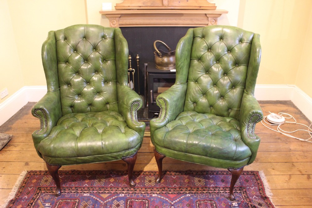 A Pair of 19thc. Leather Wing Armchairs