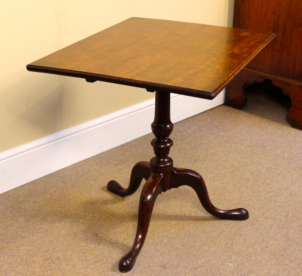 An early nineteenth-century mahogany tilt-top tripod table shown in the upright position, featuring a turned central column and three cabriole legs. View IV