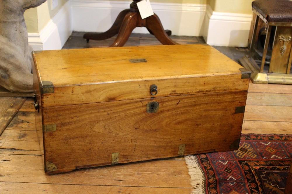 A nineteenth-century rectangular camphor wood chest featuring flush-mounted brass corner brackets, a central keyhole plate, and an overhead lid. View II