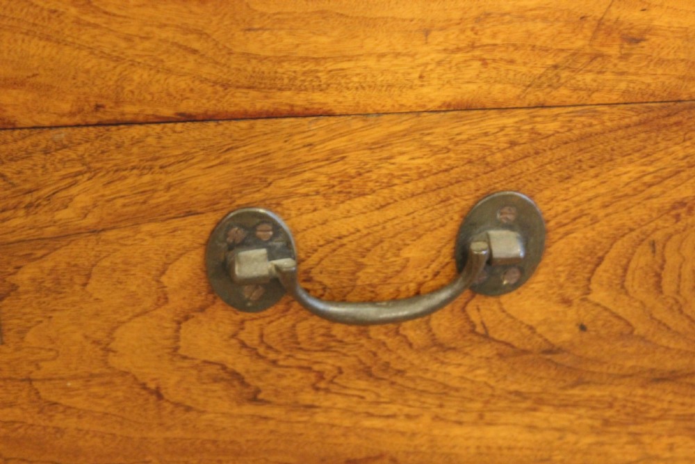 A nineteenth-century rectangular camphor wood chest featuring flush-mounted brass corner brackets, a central keyhole plate, and an overhead lid. View VII