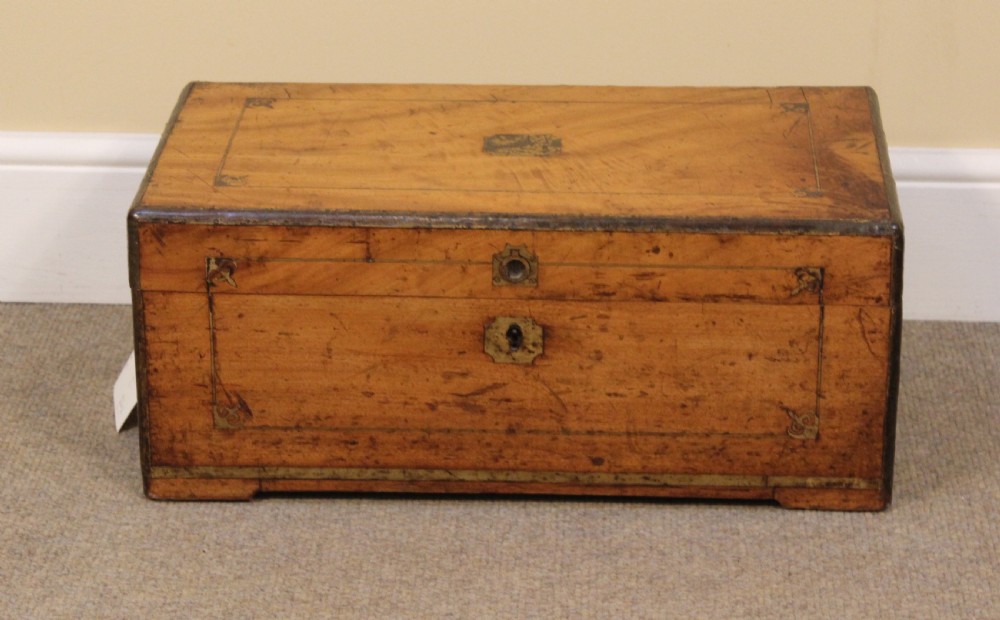 A small 19th-century rectangular camphor wood chest featuring brass inlay line work, side carrying handles, and a central brass keyhole escutcheon. View II