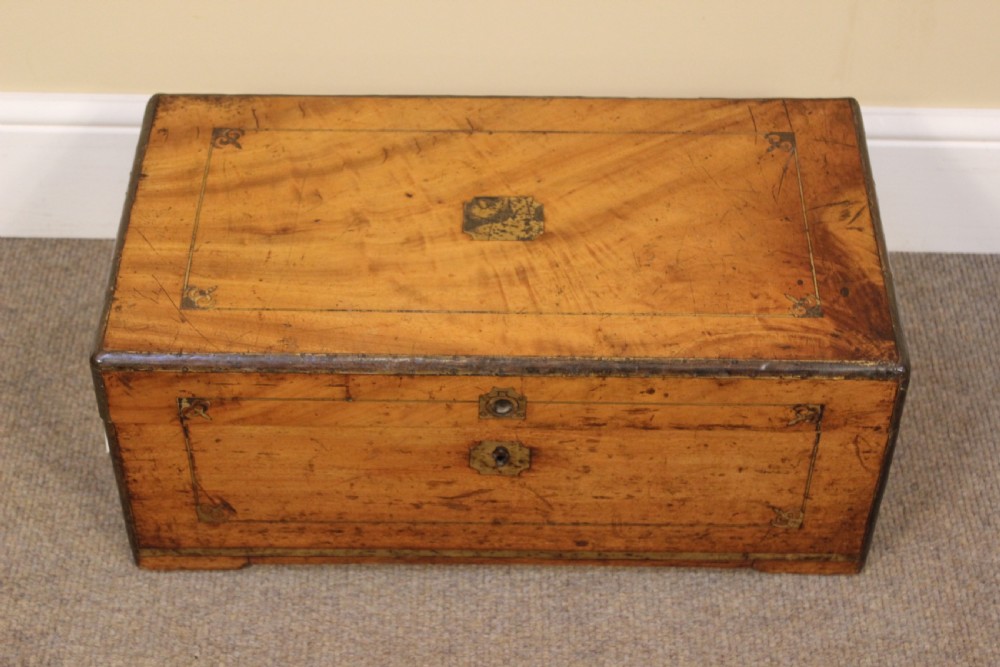 A small 19th-century rectangular camphor wood chest featuring brass inlay line work, side carrying handles, and a central brass keyhole escutcheon. View IV