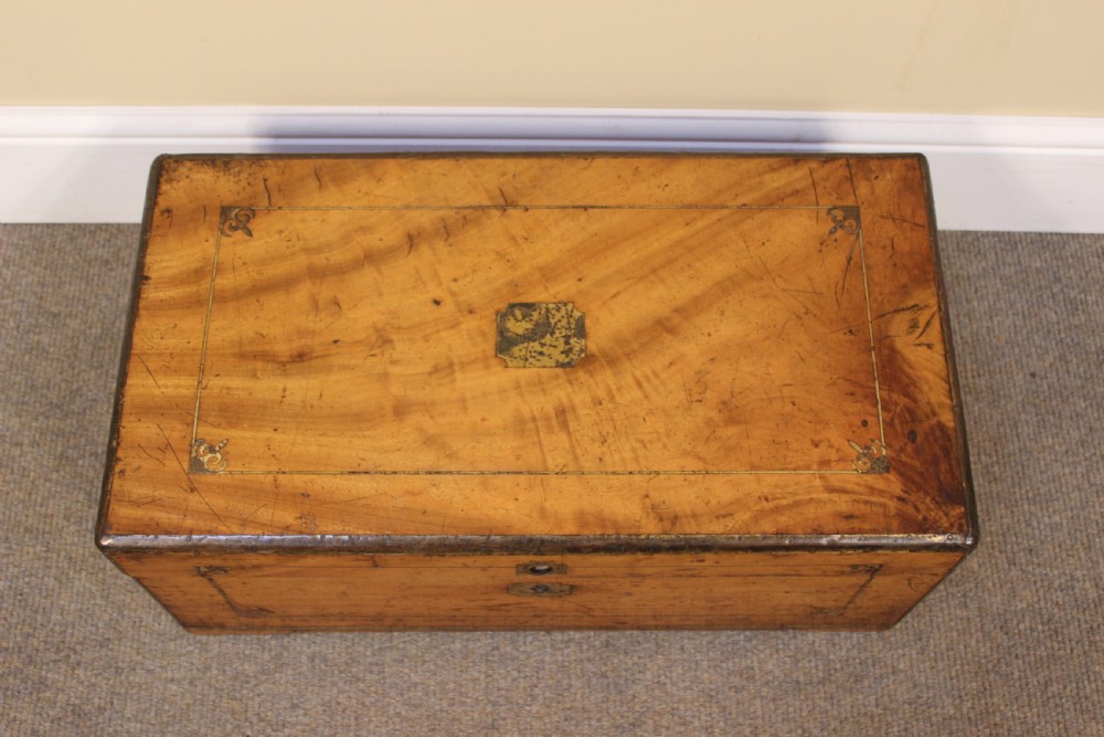 A small 19th-century rectangular camphor wood chest featuring brass inlay line work, side carrying handles, and a central brass keyhole escutcheon. View VI