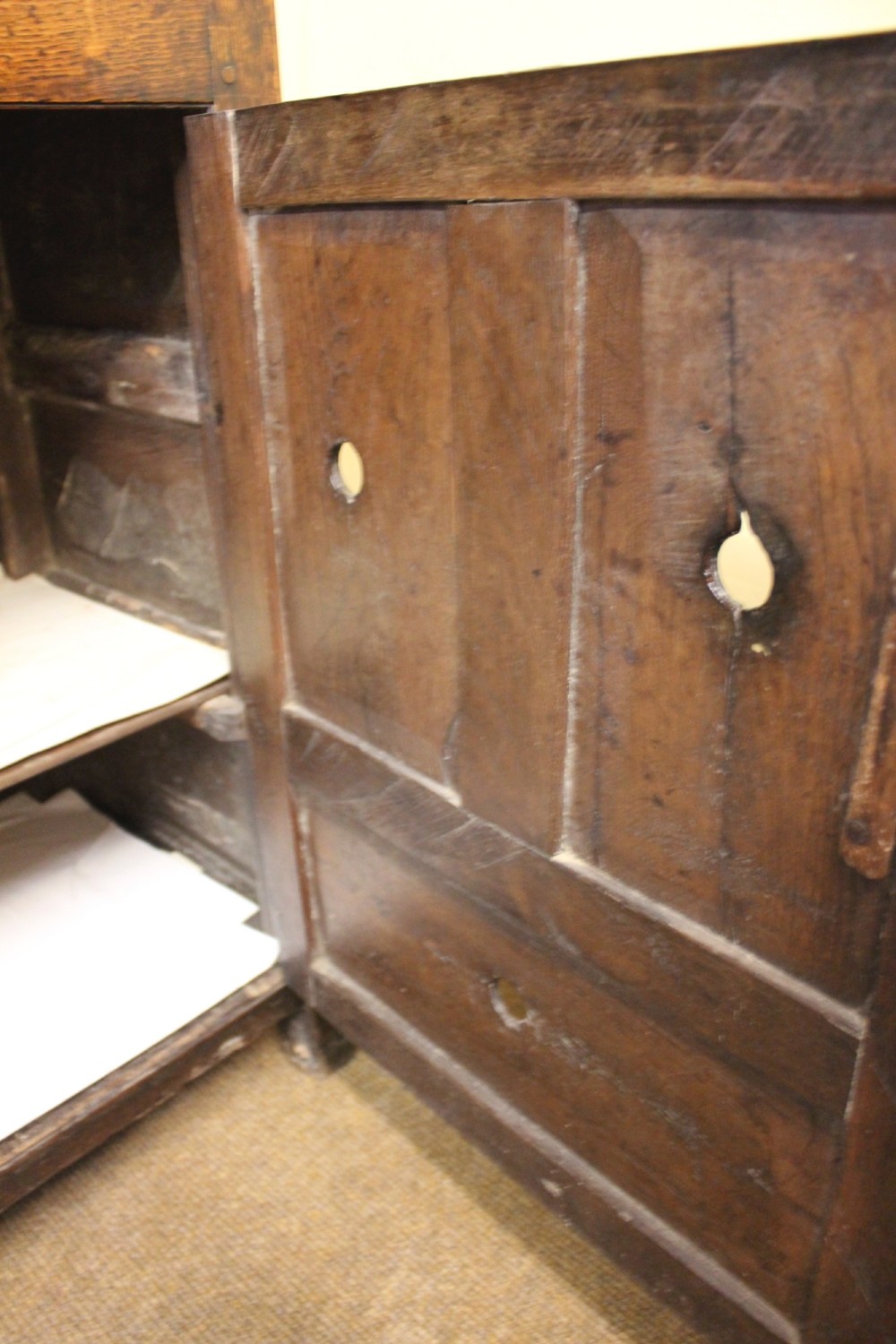 An 18th-century dark oak dresser featuring a multi-tier open plate rack above a drawer and cupboard base with a lower pot board. View VII