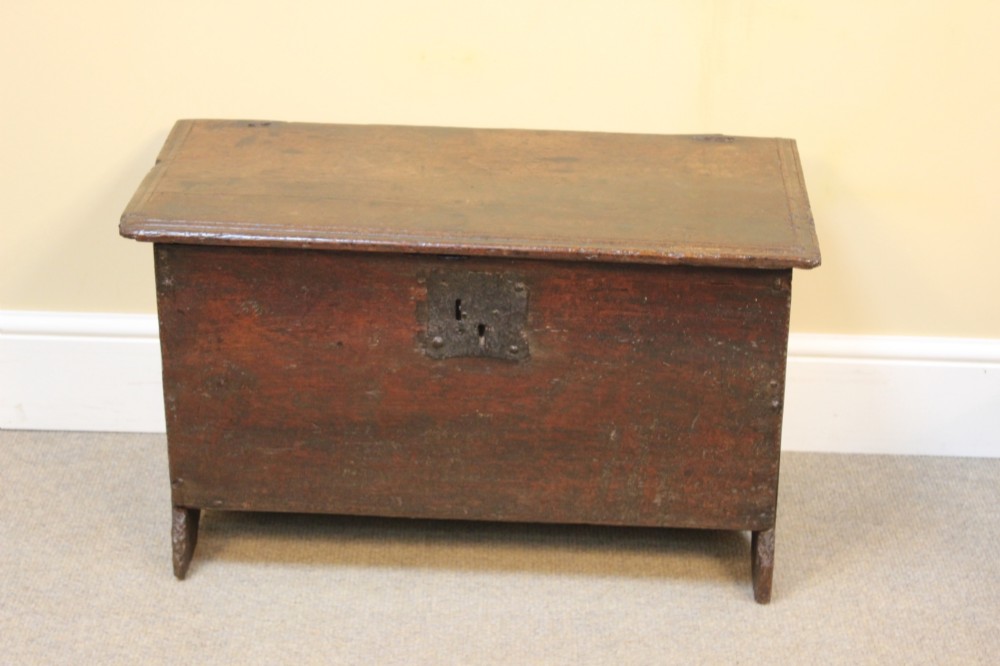 A 17th-century dark oak six-plank coffer featuring a hinged rectangular lid, hand-forged iron lockplate, and slab sides. View II